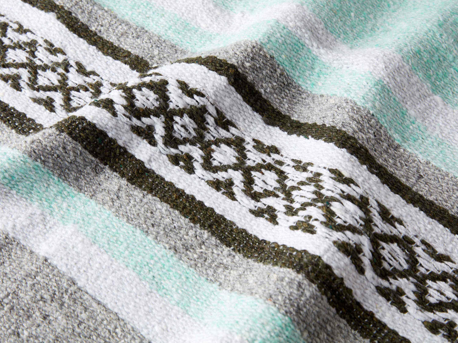Selena Gomez abuela Mexican blanket in green, grey, and white