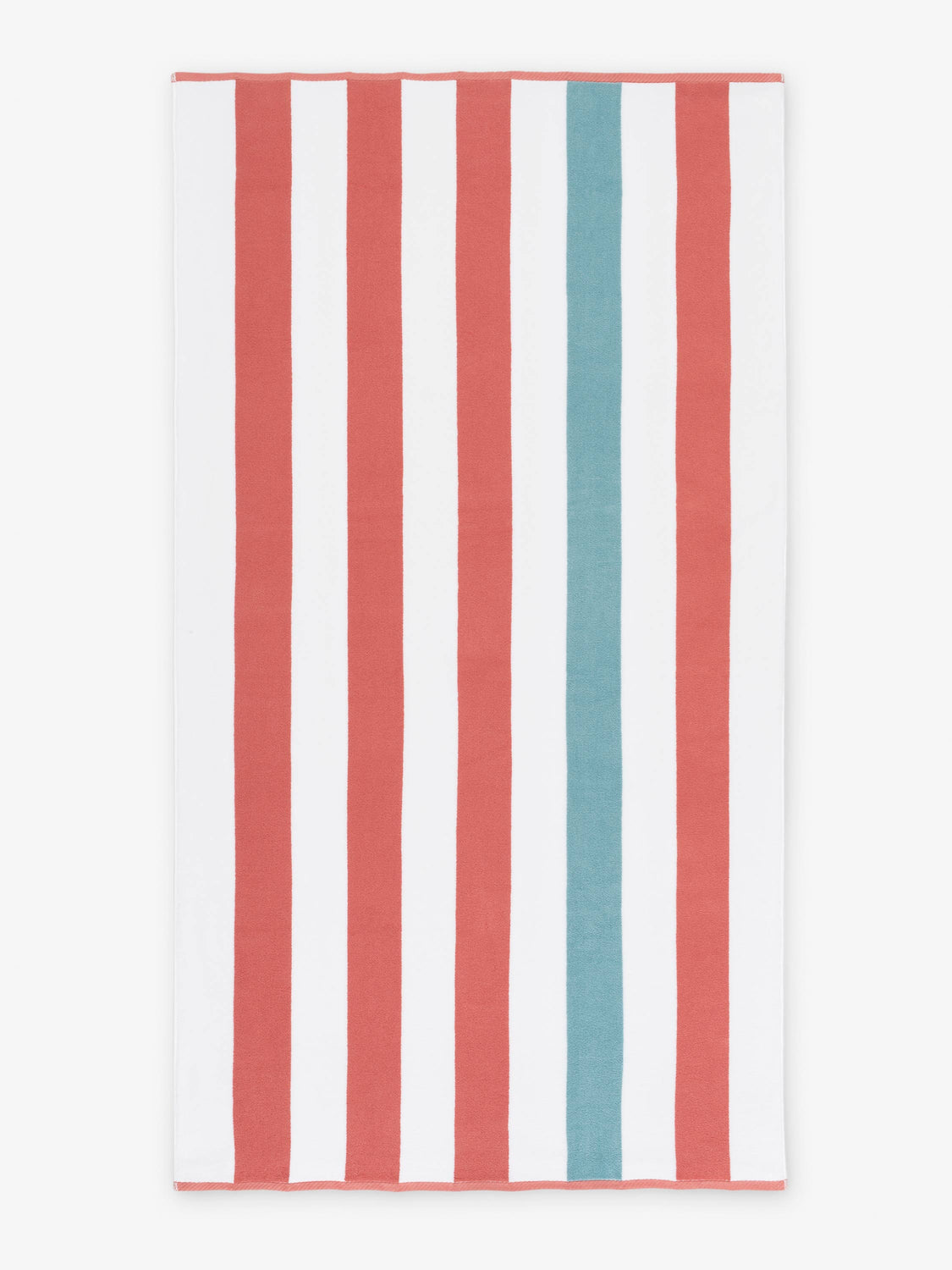 An oversized, orange, green, and white striped cabana beach towel laid out.