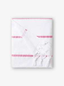 A folded white and pink striped Turkish towel with white fringe.