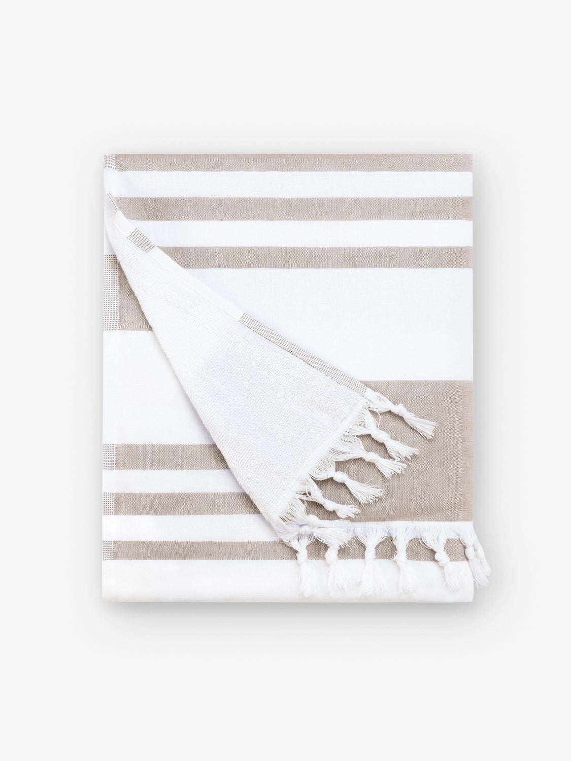 A folded tan and white striped Turkish towel with white fringe.