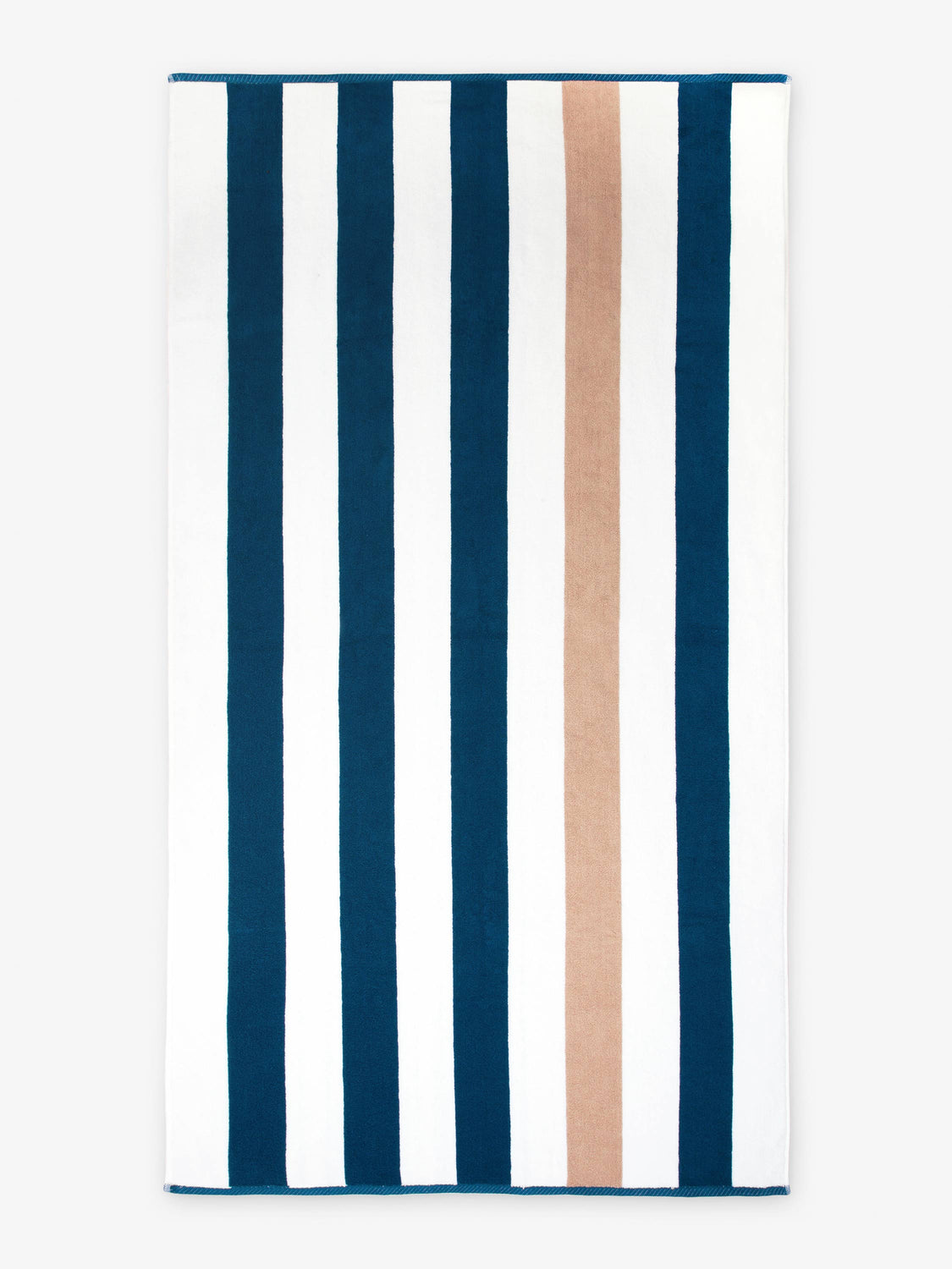 An oversized, blue, brown, and white striped cabana beach towel laid out.