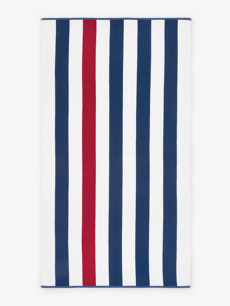 An oversized, red, white, and blue striped cabana beach towel laid out.