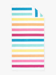 An oversized, multicolor striped cabana beach towel laid out.