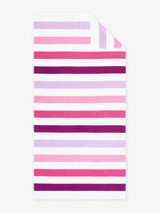 An oversized, pink, purple, and white striped cabana beach towel laid out.