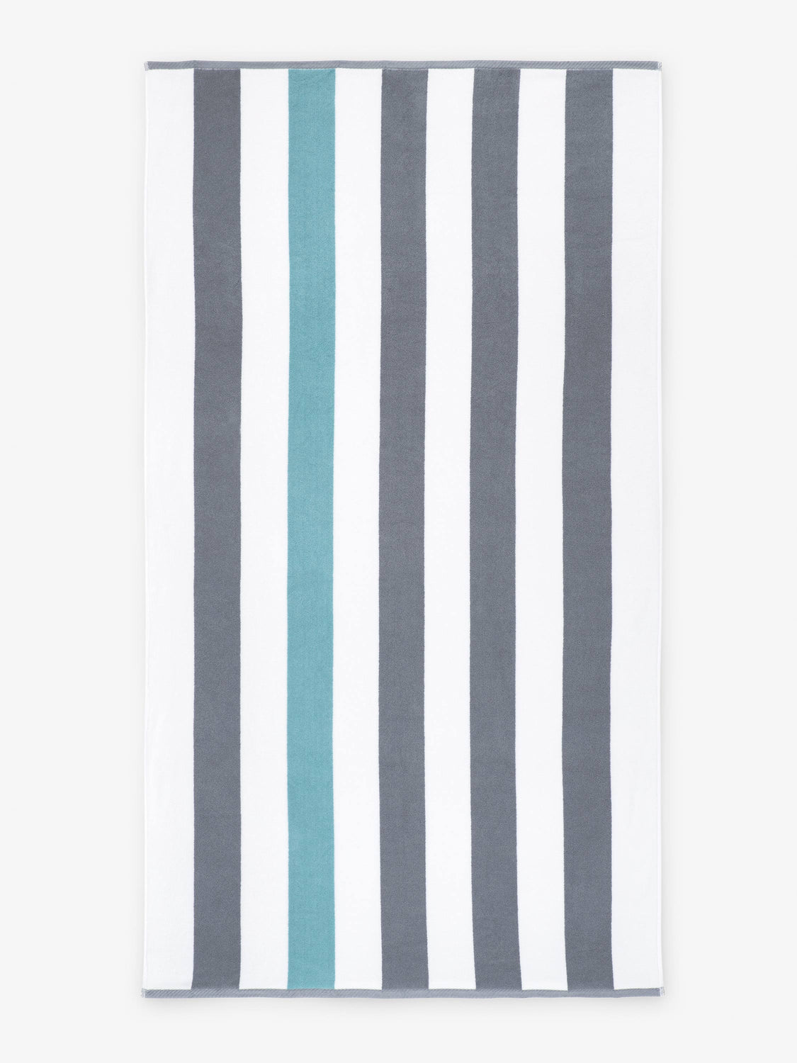 An oversized, gray, green, and white striped cabana beach towel laid out.
