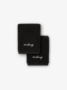 Two black makeup towels with the word makeup embroidered in white.
