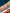 Close-up of a traditional navy blue, red, and yellow patterned Mexican blanket.
