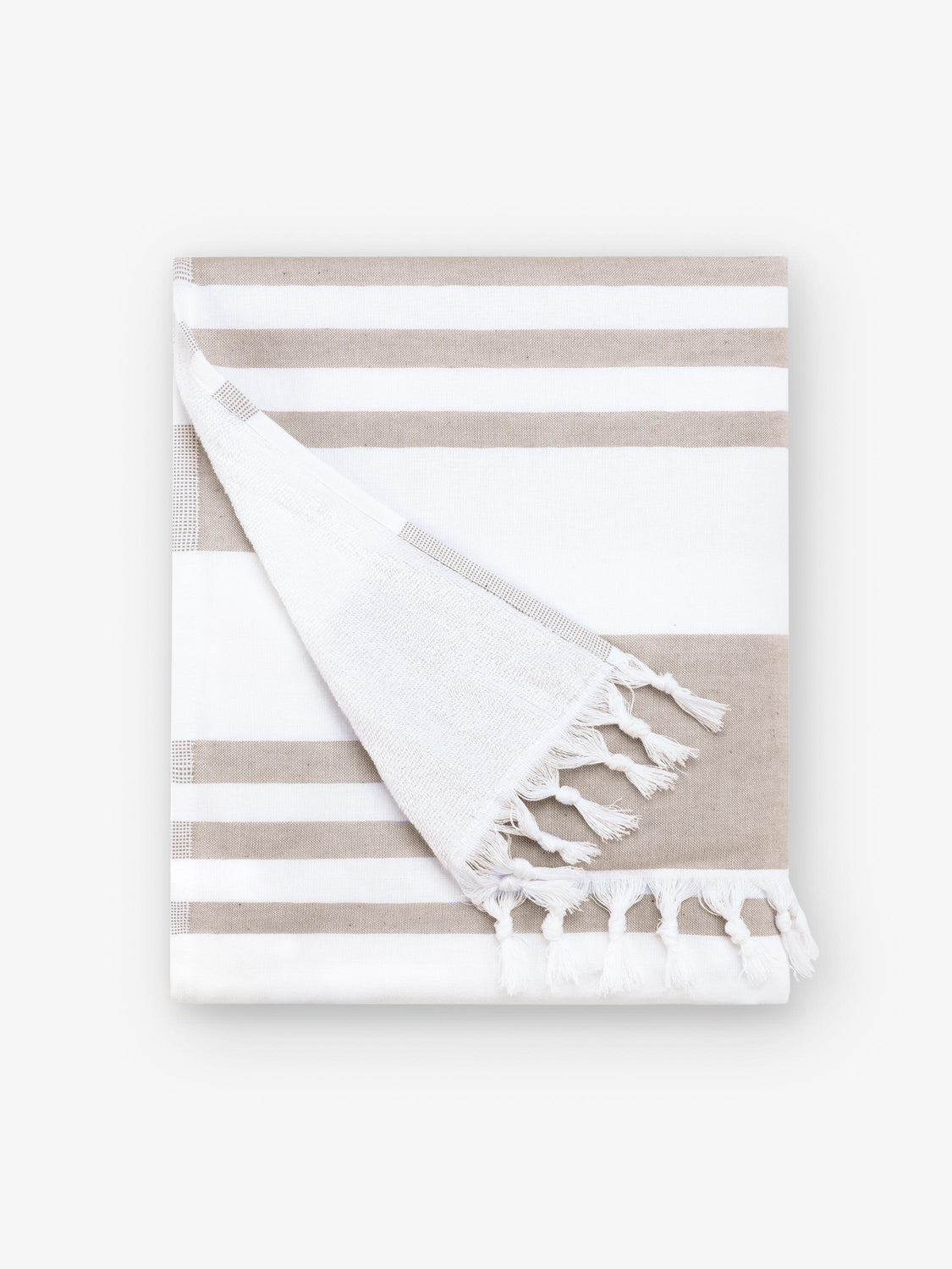 A folded tan and white striped Turkish towel with white fringe. 