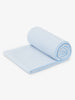 A powder blue yoga mat towel rolled up.