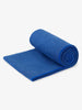 A sapphire blue yoga mat towel rolled up.